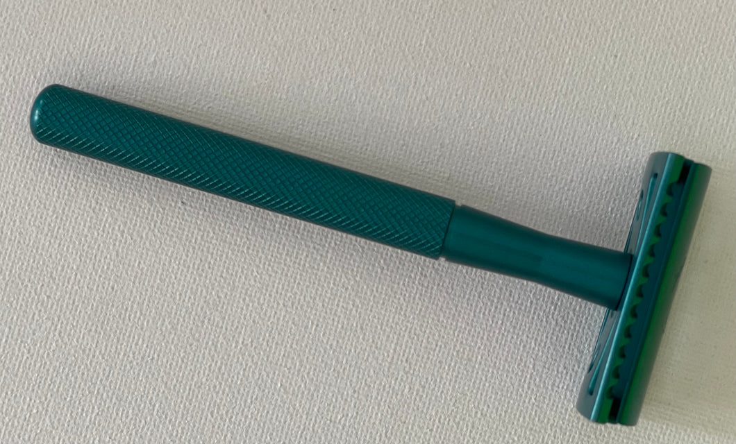 Azure or green blue metal safety razor. Comes with 5 disposable blades. Great for close shave.